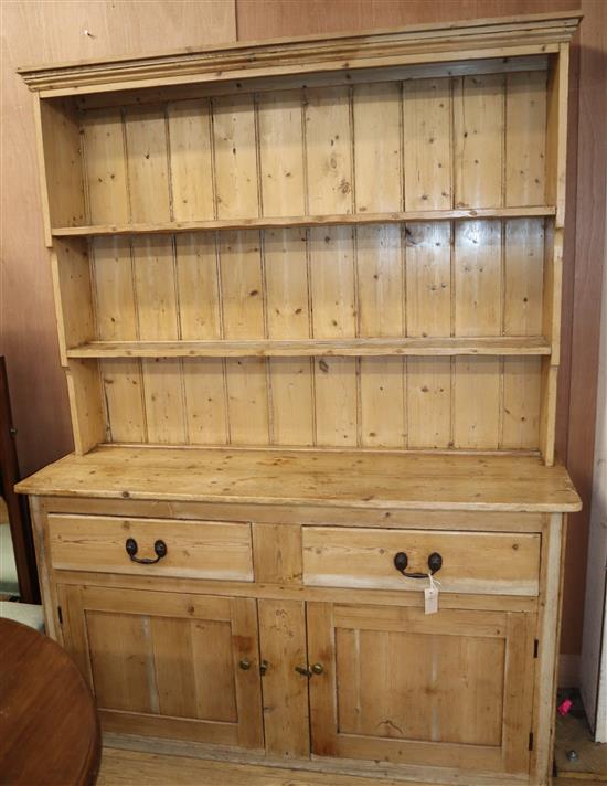 A Victorian pine dresser, with boarded plate rack W.151cm